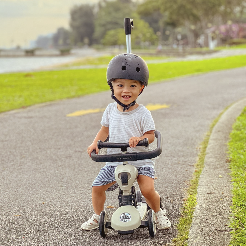Ansel using a trike to navigate a park connector | Rare Disorders Society (Singapore) [RDSS]