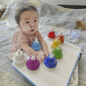 Baby Eva playing with her toys | Rare Disorders Society (Singapore) [RDSS]