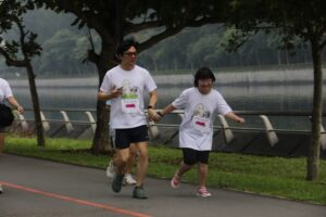 Yong Xuan and her parents at the Carry Hope Walk & Run 2026 | Rare Disorders Society (Singapore) [RDSS]