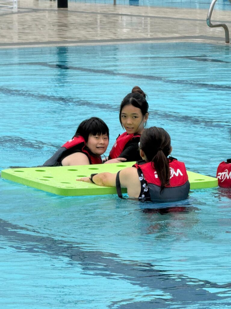 Yong Xuan attending a water-play session organised by PlayBuddy Singapore | Rare Disorders Society (Singapore) [RDSS]